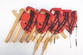 Stack of red life jackets hanging on custom wooden hanger