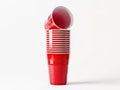 Stack of red plastic cups on white background Royalty Free Stock Photo