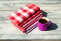 Stack of red white checkered and striped linen tableclothes and Royalty Free Stock Photo