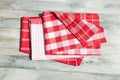 Stack of red white checkered and striped linen tableclothes on r Royalty Free Stock Photo