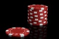 Stack of red and white poker chips on a black background close-up Royalty Free Stock Photo
