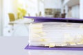 stack of reporting paper documents in a purple folder with bookmarks on the desktop in the office, business documents for annual Royalty Free Stock Photo