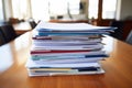 stack of resumes on an office table