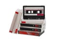 Stack of retro audio cassette tapes with one positioned upright, isolated on white back Royalty Free Stock Photo