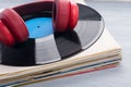 On a stack of retro records, there is a microphone on the surface of the vinyl Royalty Free Stock Photo