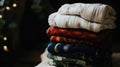 A stack of reusable cloth diapers with colorful patterns, ready for a sustainable baby care routine