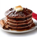Stack of Rich Chocolate Chip Pancakes with Melting Butter and Maple Syrup Royalty Free Stock Photo