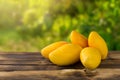 Stack of ripe mangoes fruit on wooden table Royalty Free Stock Photo