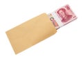 Stack of RMB paper currency half in envelope with clipping path