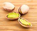 A stack of roasted pistachios on wood Royalty Free Stock Photo