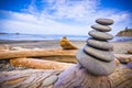 Stack of Rocks on Driftwood Royalty Free Stock Photo