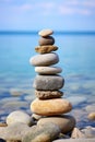 A stack of rocks on a sandy beach. Perfect for nature and relaxation concepts Royalty Free Stock Photo