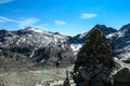 A stack of rocks with scenic view on glacier lakes in the Hohe Tauern mountain range in Carinthia and Salzburg, Austria