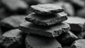 Stack of rough, dark grey flat stones balanced against soft focus background. Close up macro shot reveals natural texture of Royalty Free Stock Photo