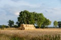 Stack of round bales of straw on a stubble field Royalty Free Stock Photo