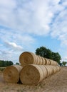 Stack of round bales of straw on a stubble field Royalty Free Stock Photo