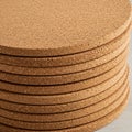 Stack of round cork coasters, each with a uniform thickness, displaying a natural light Royalty Free Stock Photo