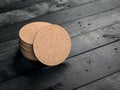 Stack of Round Cork pads, beer coaster Mockup on the black wooden table