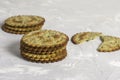 A stack of round crackers with greens and cheese on a light gray concrete background Royalty Free Stock Photo