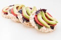 Stack of round crispbreads with cheese, tomatoes, avocado and basil Royalty Free Stock Photo