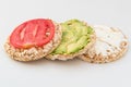 Stack of round crispbreads with cheese, tomatoes, avocado and basil Royalty Free Stock Photo
