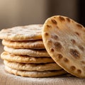 Stack of round flatbreads with a golden-brown crust and dusted with flour. They Royalty Free Stock Photo