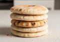 A stack of round flatbreads, resembling pita bread, on a light Royalty Free Stock Photo