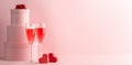 Stack of round gift boxes, glasses of red prosecco and two hearts Royalty Free Stock Photo