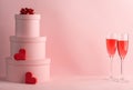 Stack of round gift boxes, red hearts and glasses of red wine for two Royalty Free Stock Photo