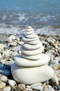 Stack of round smooth stones on a seashore. Balance peace silence concept