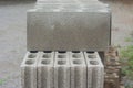 Stack row of gray concrete blocks on ground. Royalty Free Stock Photo