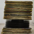 Stack of 45 rpm vinyl records arranged in a vertical stack. Royalty Free Stock Photo