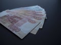 Stack of Russian money banknotes of five thousand and one thousand rubles closeup on black background Royalty Free Stock Photo