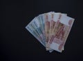 Stack of Russian money banknotes of five thousand and one thousand rubles on black background Royalty Free Stock Photo