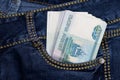 A stack of Russian thousand-ruble bills in a pocket of blue jeans. Money in your pocket, cash. Royalty Free Stock Photo