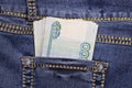 A stack of Russian thousand-ruble bills in a pocket of blue jeans. Money in your pocket, cash. Royalty Free Stock Photo