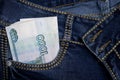 A stack of Russian thousand-ruble bills in a pocket of blue jeans. Money in your pocket, cash. Royalty Free Stock Photo