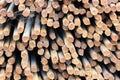 stack of rusty rebar lies near to the freeway construction site.