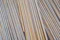 Stack of rusty round steel bar - iron metal rail lines material