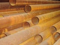 Stack of rusty steel pipes in an industrial warehouse Royalty Free Stock Photo