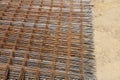 Stack of rusty wire mesh at a construction site. Metal building grate. Royalty Free Stock Photo