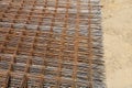 Stack of rusty wire mesh at a construction site. Metal building grate. Royalty Free Stock Photo