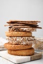 Stack of rye crispbreads, rice cakes and rusks on table, closeup Royalty Free Stock Photo