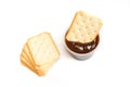 Stack of salted crackers on white background. Biscuit dipped in barbecue sauce inside of plastic package