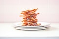 stack of salted pretzels on white plate