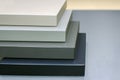 A stack of samples of furniture facades