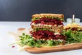 stack of sandwich slices, beetroot salad to the side
