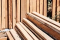 Stack of sawed wooden planks or timber at a construction site