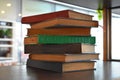 The stack of seven books on the shelf