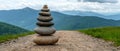 A stack of seven rocks on a dirt path. Royalty Free Stock Photo